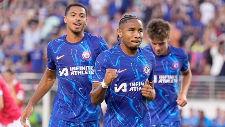 Chelsea forward Christopher Nkunku, center, celebrates after scoring in a pre-season friendly against Wrexham