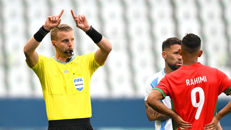 SAINT-ETIENNE, FRANCE - JULY 24: Referee Glenn Nyberg gestures after VAR disallowed Team Argentina&#39;s second goal during the Men&#39;s group B match between Argentina and Morocco during the Olympic Games Paris 2024 at Stade Geoffroy-Guichard on July 24, 2024 in Saint-Etienne, France. (Photo by Tullio M. Puglia/Getty Images)