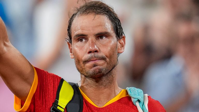 Rafael Nadal reacts waves after losing with his teammate Carlos Alcaraz of Spain against Austin Krajicek and Rajeev Ram of the USA during the men&#39;s doubles quarter-final tennis competition at the Roland Garros stadium, at the 2024 Summer Olympics, Wednesday, July 31, 2024, in Paris, France. (AP Photo/Manu Fernandez)