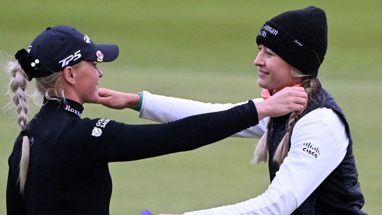 England&#39;s Charley Hull (L) and US&#39; Nelly Korda hug each other at the end of the opening day of the 2024 Women&#39;s British Open Golf Championship, on the Old Course at St Andrews, in St Andrews, Scotland, on August 22, 2024. (Photo by ANDY BUCHANAN / AFP) / RESTRICTED TO EDITORIAL USE 