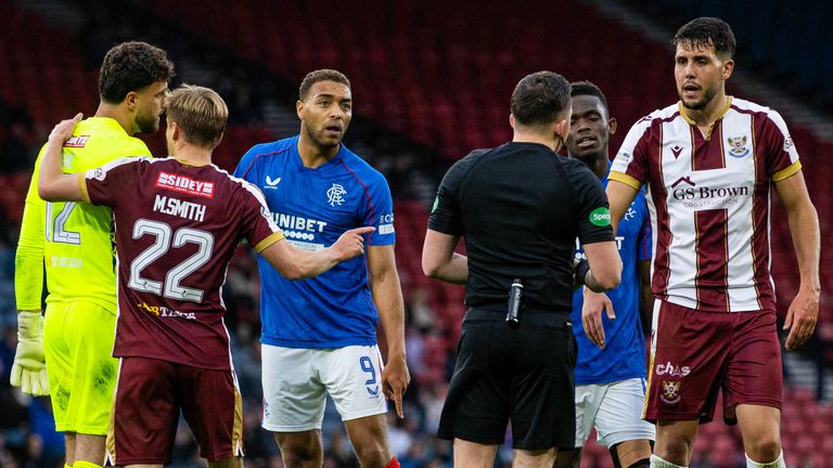 GLASGOW, SCOTLAND - AUGUST 17: Rangers&#39; Cyriel Dessers pleads his innocence before a VAR check confirms his goal to make it 1-0 following a potential foul on St Johnstone&#39;s Jack Sanders (R) during a Premier Sports Cup last sixteen match between Rangers and St Johnstone at Hampden Park, on August 17, 2024, in Glasgow, Scotland.  (Photo by Craig Williamson / SNS Group)