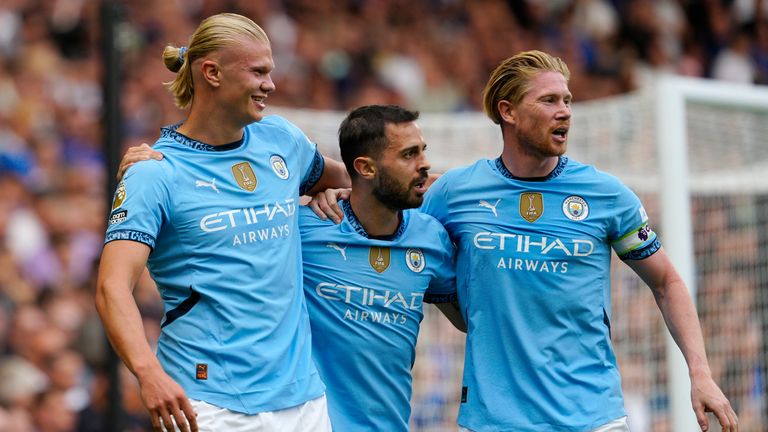 Manchester City&#39;s Erling Haaland celebrates with Bernardo Silva and Kevin De Bruyne after scoring his side&#39;s opening goal (AP Photo/Dave Shopland)