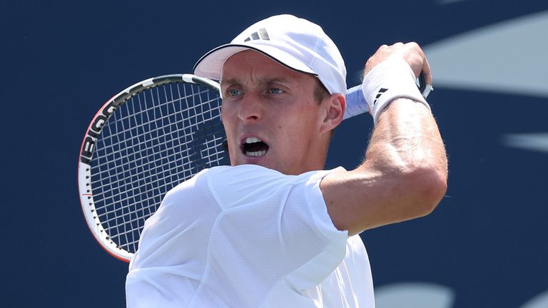 Jan Choinski of Great Britain returns against Roberto Carballes Baena of Spain during their Men&#39;s Singles First Round match on Day One of the 2024 US Open 