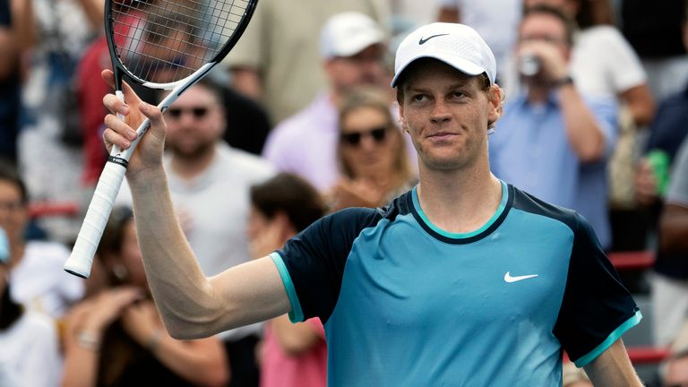 CORRECTS TO BORNA CORIC NOT BORJA CORIC - Italy&#39;s Jannik Sinner salutes the crowd after defeating Croatia&#39;s Borna Coric in straight sets during their second-round match at the National Bank Open tennis tournament Thursday, Aug. 8, 2024, in Montreal. (Ryan Remiorz/The Canadian Press via AP)