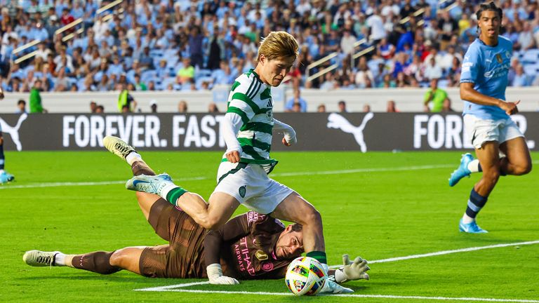 NORTH CAROLINA, USA - JULY 23: Celtic&#39;s Kyogo Furuhashi scores to make it 3-1 during a pre-season friendly match between Manchester City and Celtic at Kenan Stadium, on July 23, 2024, in North Carolina, USA.  (Photo by Ross MacDonald / SNS Group)