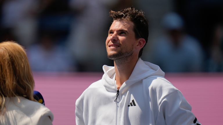 Dominic Thiem, of Austria, watches highlights of his play over the years at the U.S. Open after losing to Ben Shelton, of the United States, during the first round of the U.S. Open tennis championships, Monday, Aug. 26, 2024, in New York. (AP Photo/Seth Wenig)