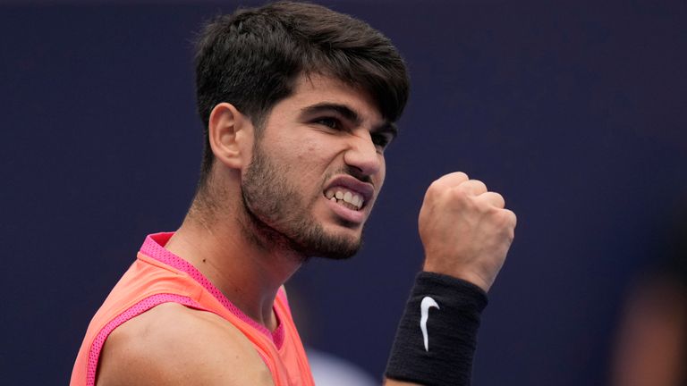 Carlos Alcaraz of Spain celebrates a point against Giovanni Mpetshi Perricard of France during the China Open tennis tournament held at the National Tennis Center in Beijing, Friday, Sept. 27, 2024. (AP Photo/Ng Han Guan)