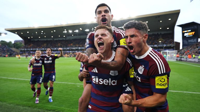 Harvey Barnes of Newcastle United celebrates with Fabian Schar and Bruno Guimaraes after scoring their second goal