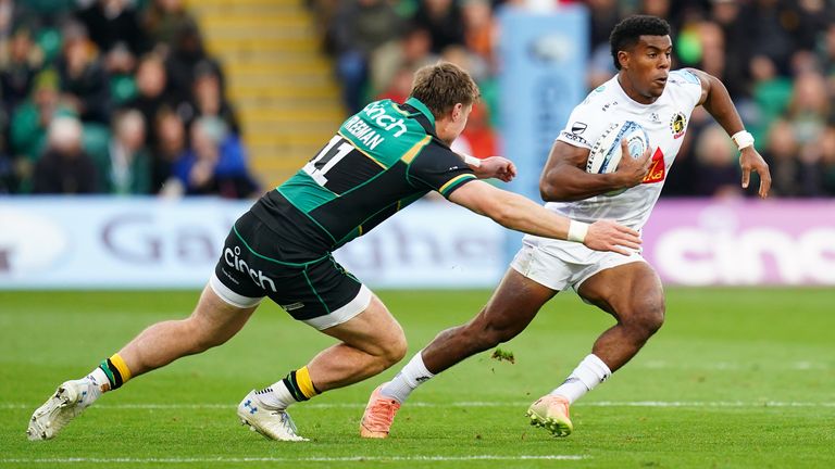 Exeter Chief's Immanuel Feyi-Waboso (right) taking on Northampton Saints Tommy Freeman during the Gallagher Premiership match at cinch Stadium at Franklin's Gardens, Northampton. Picture date: Saturday September 28, 2024.