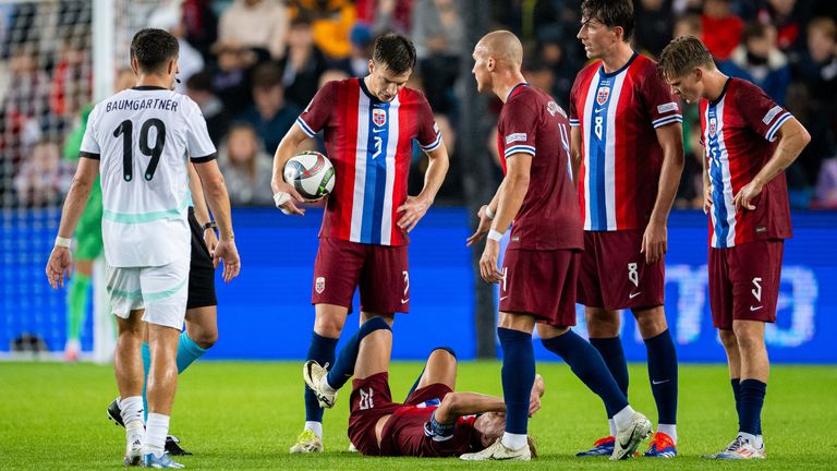 Martin Odegaard lies in pain after suffering the injury