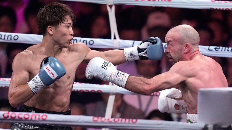 Japanese champion Naoya Inoue, left, and Irish challenger TJ Doheny, right, during the first round of a boxing match for the unified WBA, WBC, IBF and WBO super bantamweight world titles in Tokyo, Tuesday, Sept. 3, 2024. (AP Photo/Hiro Komae)