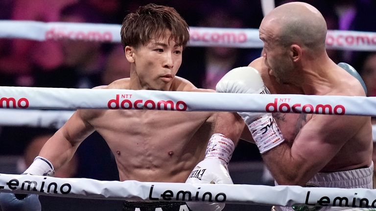 Japanese champion Naoya Inoue, left, and Irish challenger TJ Doheny, right, during the first round of a boxing match for the unified WBA, WBC, IBF and WBO super bantamweight world titles in Tokyo, Tuesday, Sept. 3, 2024. (AP Photo/Hiro Komae)