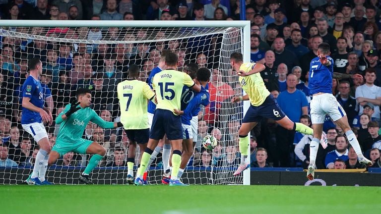 Harwood-Bellis rises to direct his header into the corner