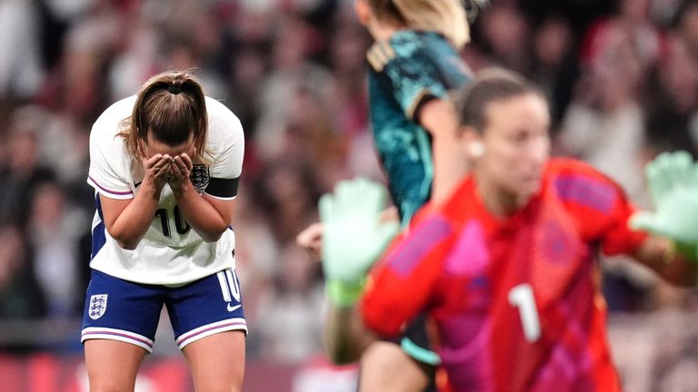 Ella Toone puts her head in her hands after missing a good chance for England. 