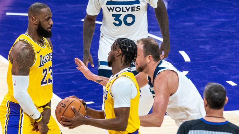 Los Angeles Lakers' LeBron James #23 sets a screen for Bronny James #9 against Minnesota Timberwolves' Joe Ingles #7 during an NBA basketball game at Crypto.com Arena on Tuesday, Oct. 22, 2024 in Los Angeles. (Ringo Chiu via AP) 