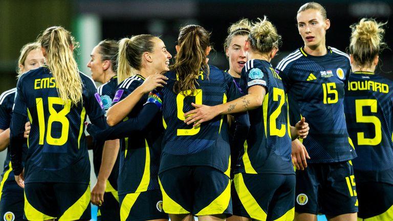 Scotland's Caroline Weir celebrates with Martha Thomas and Kirsty Smith after scoring to make it 3-0 at Easter Road