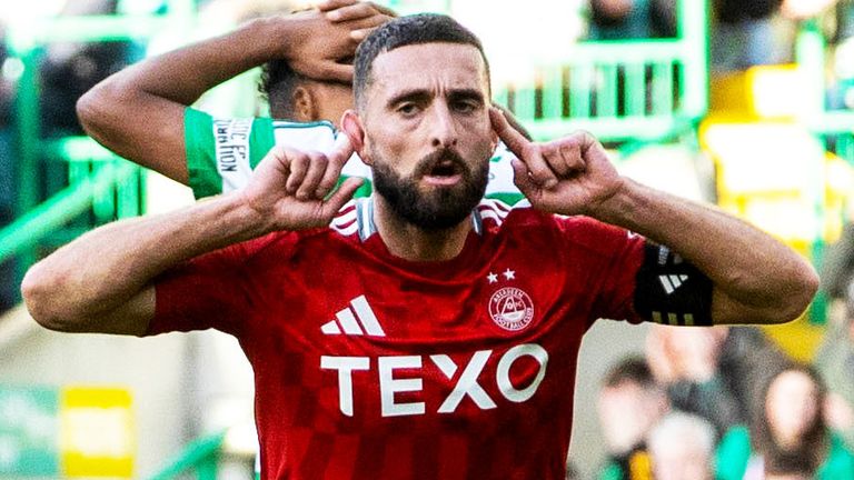 Graeme Shinnie celebrates after equalising for Aberdeen at Celtic