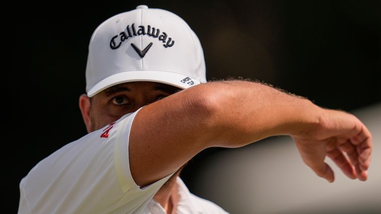 Xander Schauffele wipes sweat on the seventh green during the second round of the Tour Championship golf tournament, Friday, Aug. 30, 2024, in Atlanta. (AP Photo/Mike Stewart)