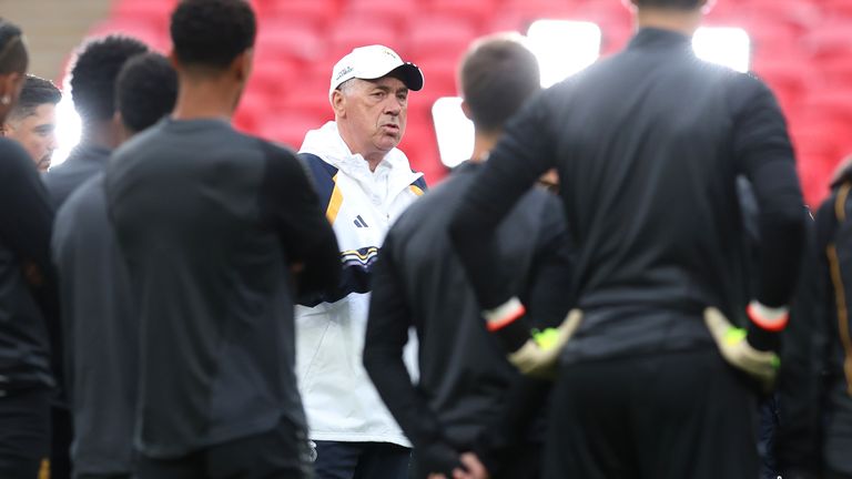 Carlo Ancelotti, Head Coach of Real Madrid, speaks with coaching staff and players of Real Madrid as they huddle during a Real Madrid CF Training Session ahead of their UEFA Champions League 2023/24 Final match against Borussia Dortmund at Wembley Stadium on May 31, 2024 in London, England.