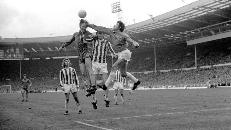 Stoke City goalkeeper Gordon Banks challenges Chelsea's John Dempsey for the ball.