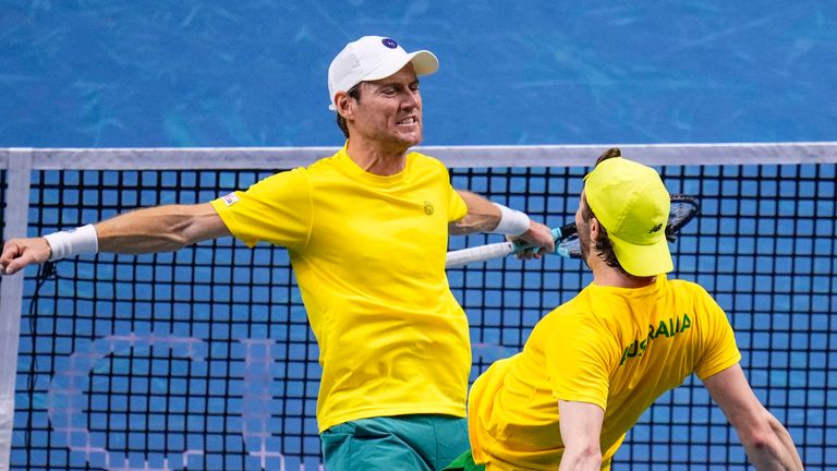 Australia's Matthew Ebden, left, and Jordan Thompson celebrate their victory against Tommy Paul and Ben Shelton of the United States, during their doubles tennis quarterfinal Davis Cup match at the Martin Carpena Sports Hall, in Malaga, southern Spain, on Thursday, Nov. 21, 2024. (AP Photo/Manu Fernandez)