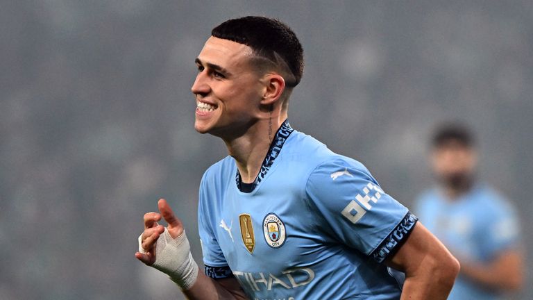 Phil Foden celebrates his opener against Sporting