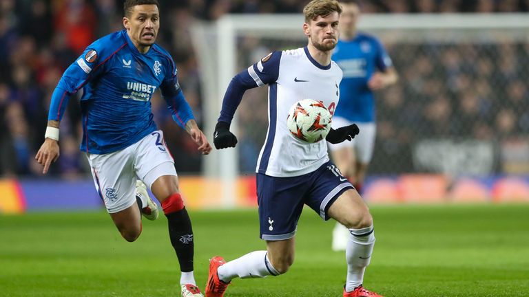 Tottenham's Timo Werner shields the ball from Rangers' James Tavernier during the Europa League opening phase soccer match between Glasgow Rangers and Tottenham Hotspur at Ibrox stadium in Glasgow, Thursday, Dec. 12, 2024. (AP Photo/Scott Heppell)