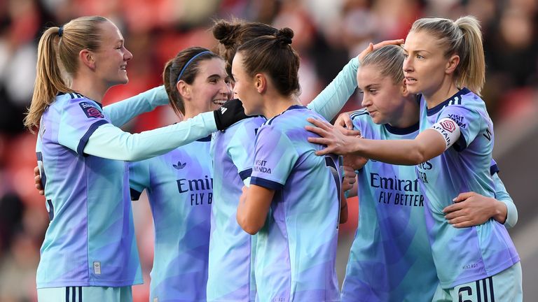 Alessia Russo is congratulated after opening the scoring for Arsenal at Liverpool