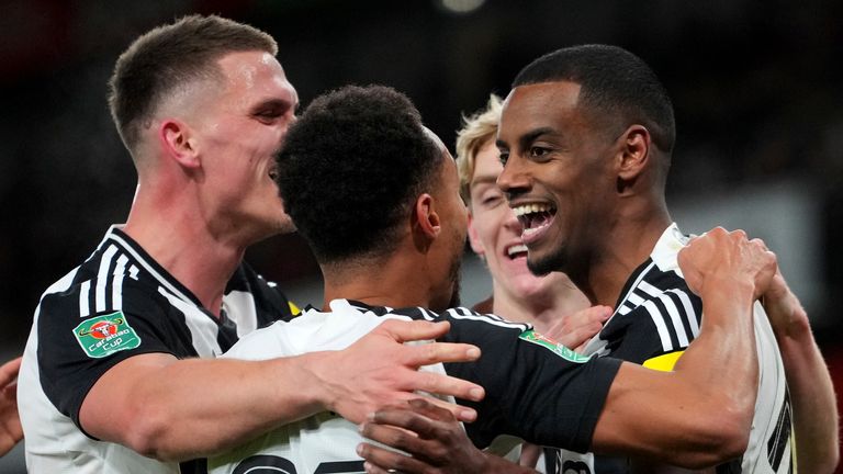 Newcastle's Alexander Isak, right, celebrates with teammates after scoring the opening goal during the English League Cup semifinal first leg soccer match between Arsenal and Newcastle United at the Emirates stadium in London, Tuesday, Jan. 7, 2025. (AP Photo/Kirsty Wigglesworth)