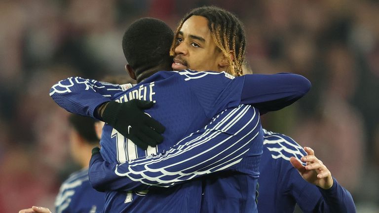 Goalscorers Ousmane Dembele and Bradley Barcola celebrate during PSG's Champions League clash with Stuttgart