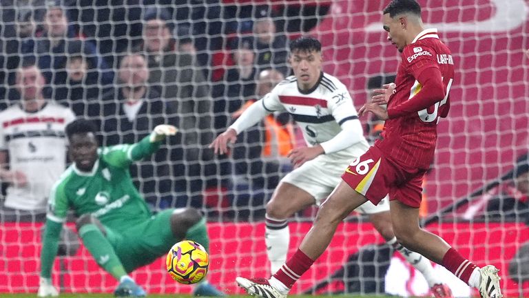 Liverpool's Trent Alexander-Arnold attempts a shot on goal against Manchester United