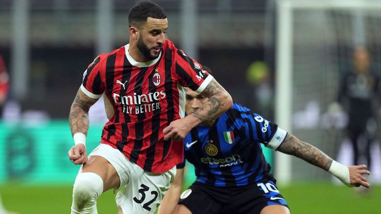 AC Milan's Kyle Walker controls the ball watched by Inter Milan's Lautaro Martinez during the Serie A soccer match between AC Milan and Inter Milan at the San Siro stadium, in Milan, Italy, Sunday, Feb. 2, 2025. (AP Photo/Antonio Calanni)