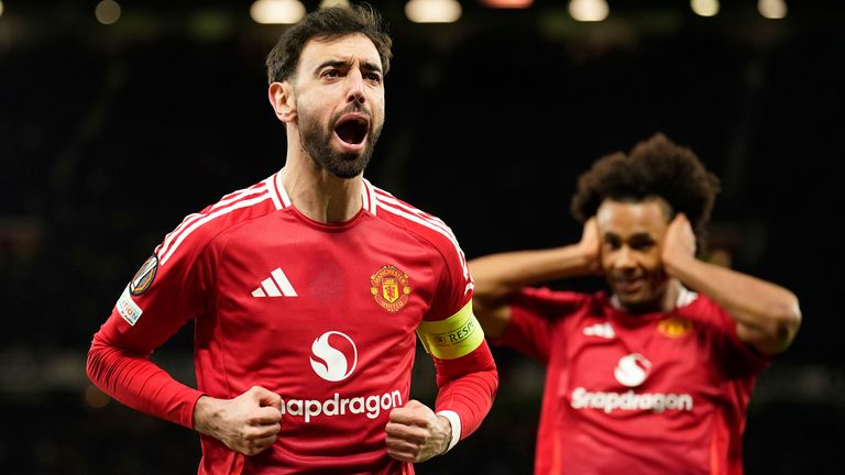 Manchester United's Bruno Fernandes celebrates scoring his side's first goal during the Europa League soccer match between Manchester United and Real Sociedad at Old Trafford stadium in Manchester, England, Thursday, March 13, 2025 . (AP Photo/Dave Thompson)