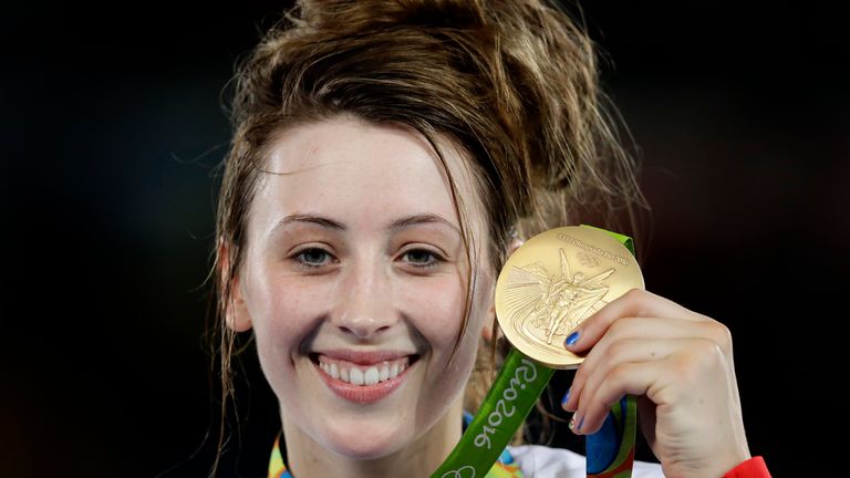 Jade Jones, of Britain, shows off her gold medal the 2016 Summer Olympics in Rio de Janeiro, Brazil