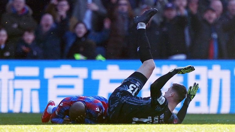 Crystal Palace's Jean-Philippe Mateta lies injured following a high boot from Millwall goalkeeper Liam Roberts