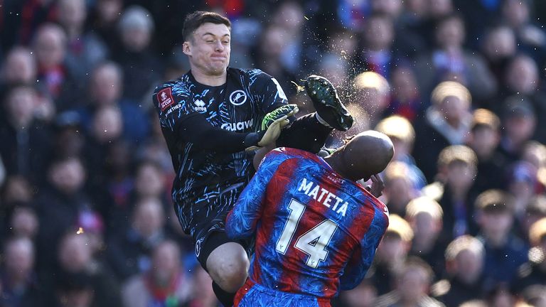 Millwall goalkeeper Liam Roberts kicks Jean-Philippe Mateta in the head with a high boot, leaving the Crystal Palace forward needing lengthly treatment