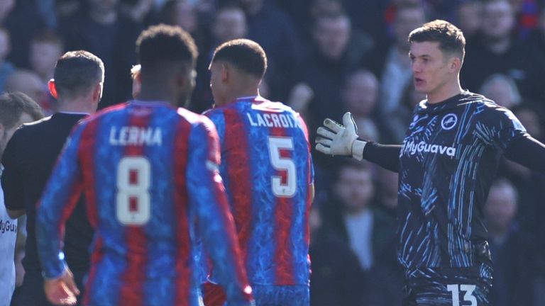 Millwall goalkeeper Liam Roberts reacts before receiving a red card for a high challenge on Crystal Palace's Jean-Philippe Mateta (AP Photo/Ian Walton)