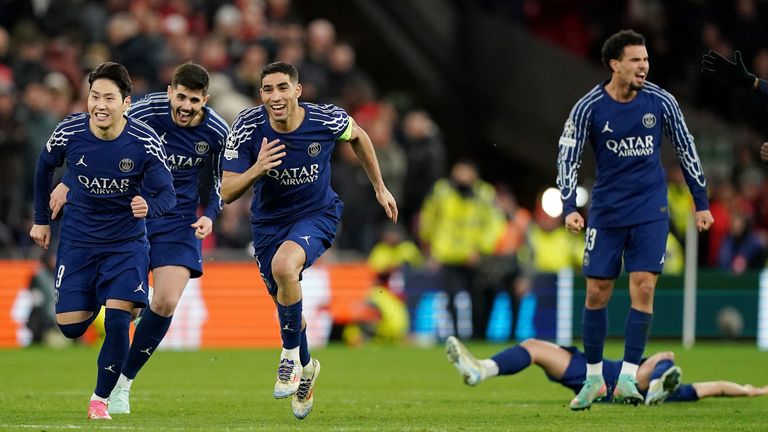 PSG players celebrate after winning a penalty shootout against Liverpool to reach the Champions League quarter-finals