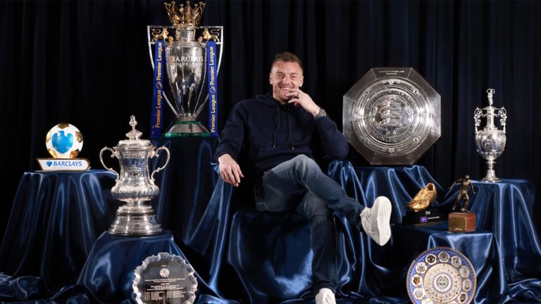 Jamie Vardy poses with the numerous trophies he has won during his time at Leicester