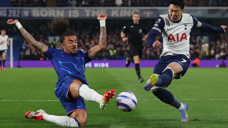 Chelsea's Malo Gusto blocks a shot from Tottenham's Heung-Min Son