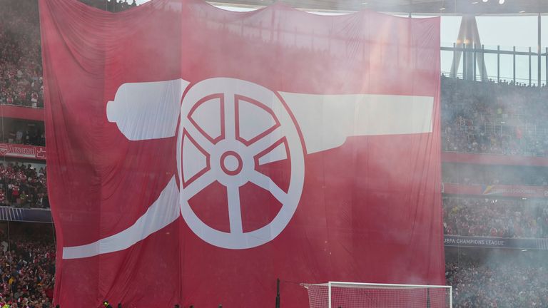 A large Arsenal flag is unfurled by supporters ahead of the Champions League semifinal first leg soccer match between Arsenal and Paris Saint-Germain at Emirates Stadium in London, England, Tuesday, April 29, 2025. (AP Photo/Kirsty Wigglesworth)
