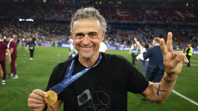 Luis Enrique holds his winners medal 