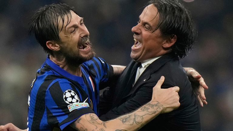 Inter Milan's head coach Simone Inzaghi, right, celebrates with Inter Milan's Francesco Acerbi at the end of the Champions League semifinal second leg soccer match between Inter Milan and Barcelona at San Siro stadium in Milan , Italy, Tuesday, May 6, 2025. (AP Photo/Luca Bruno)