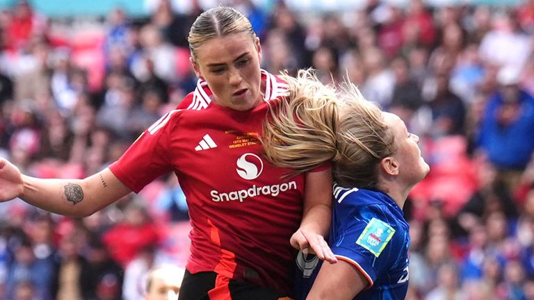 Grace Clinton directs a header at the Chelsea goal