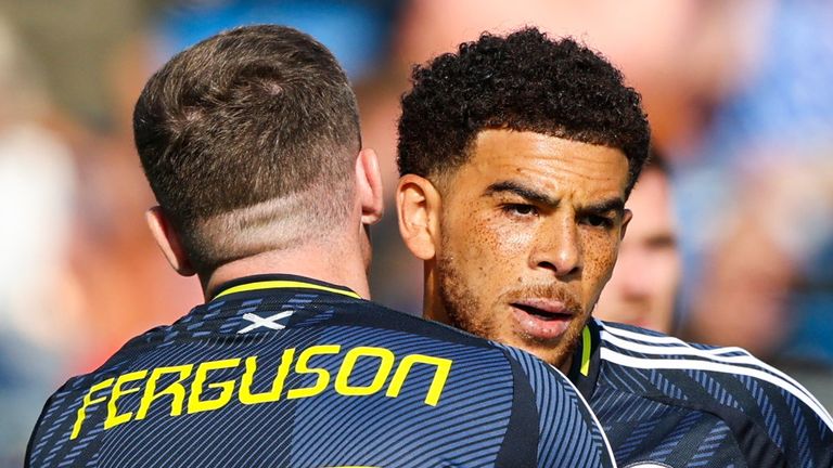 VADUZ, LIECHTENSTEIN - JUNE 08: Scotland's Che Adams (R) celebrates scoring to make it 1-0 with teammate Lewis Ferguson during an International Friendly match between Liechtenstein and Scotland at Rheinpark Stadion, on June 08, 2025, in Vaduz, Liechtenstein. (Photo by Craig Williamson / SNS Group)