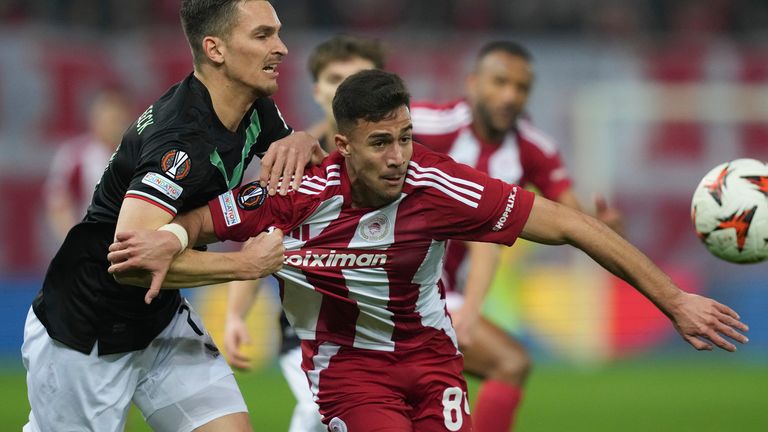 Charalampos Kostoulas vies for possession against Twente in the Europa League