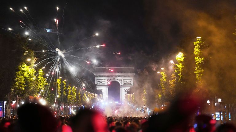 Fans celebrate PSG's victory on the Champs-Elysees
