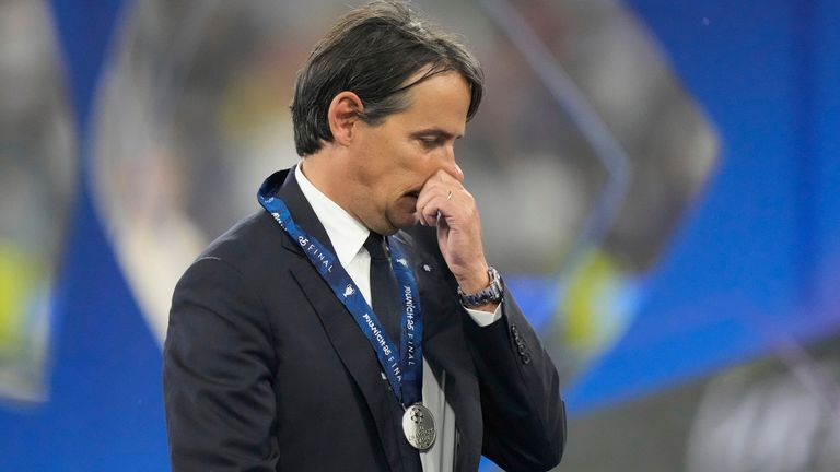 Inter Milan's head coach Simone Inzaghi with his runners-up medal after his side lost 5-0 to PSG in the Champions League final