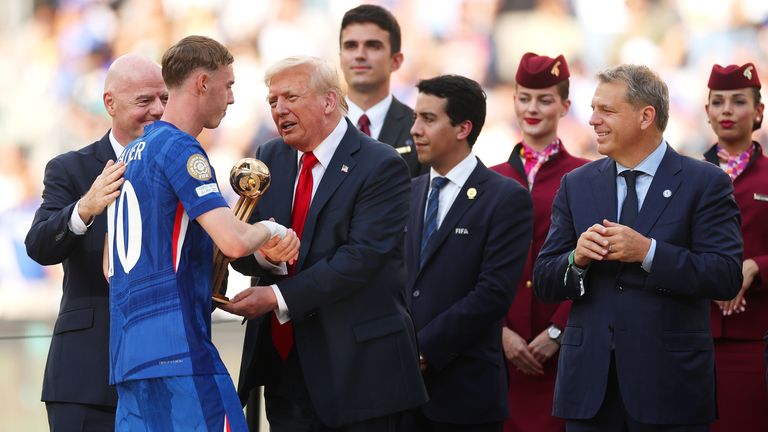 Cole Palmer is handed the Best Player of the Tournament award by USA President Donald Trump, with Chelsea co-owner Todd Boehly looking on