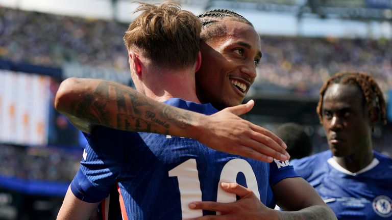 Joao Pedro embraces Cole Palmer after scoring the third